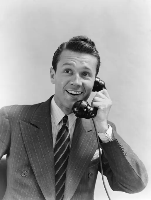 1930S Man In Suit Talking On Telephone