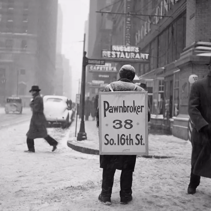 1930S Winter Street Scene Of Man Wearing Pawnbroker Sandwich Board