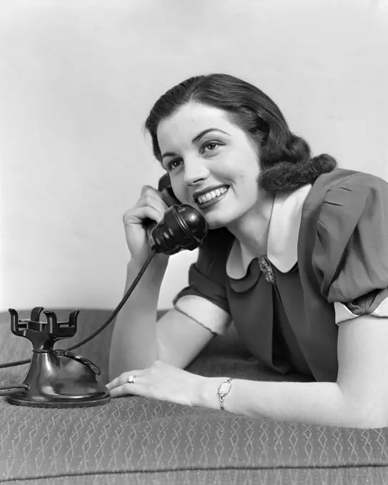 1930S 1940S Girl Talking On Telephone