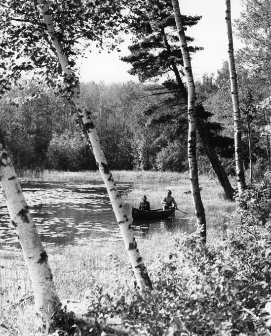 1940S Pair Of Men Canoeing In Lake Of The Woods Ontario Canada