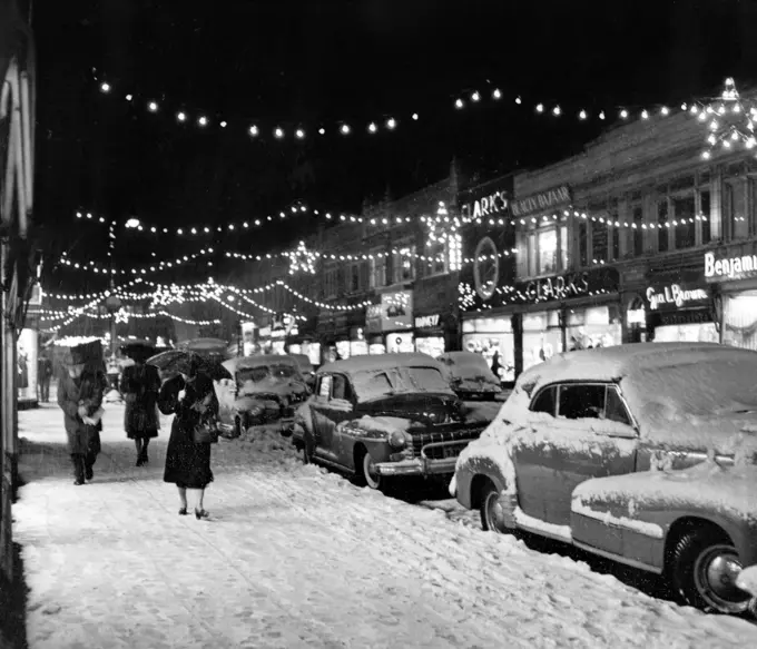 1940S 1950S Winter City Street Scene With Pedestrians In Snow Christmas Lights