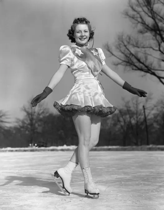 1940S Smiling Woman Figure Skater Performer On Ice Wearing Dress And Gloves