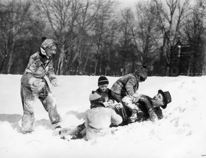 1930S Father And Mother With 3 Kids Dressed In Winter Clothing Playing In Snow Field