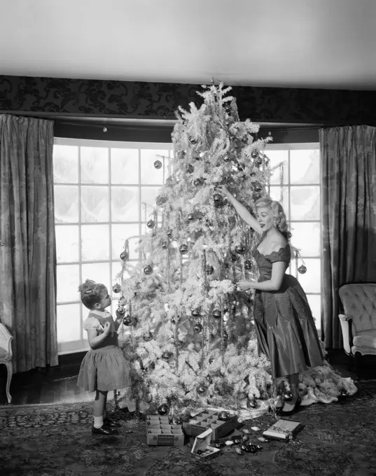 1950S Mother And Daughter Decorating Christmas Tree Ornaments