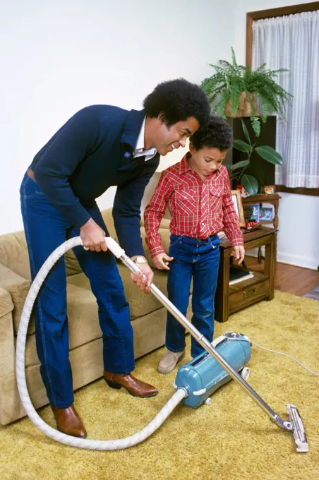 1980s FATHER AND SON VACUUM CLEANING GOLD SHAG CARPET 