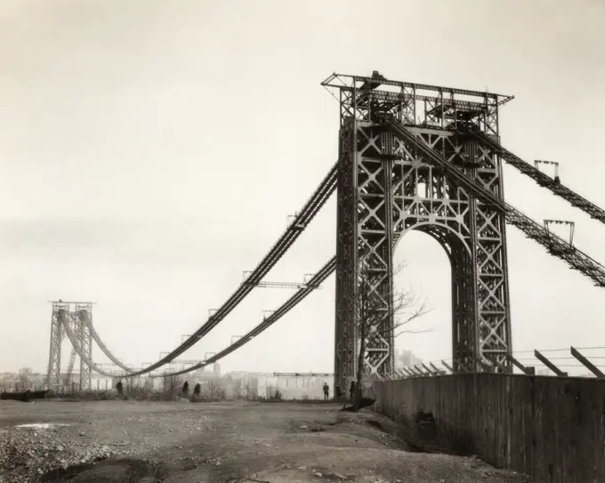 1920s 1930s VIEW OF GEORGE WASHINGTON SUSPENSION BRIDGE WHILE UNDER CONSTRUCTION FROM NJ TO NEW YORK TWO TOWERS BUT NO ROADWAY