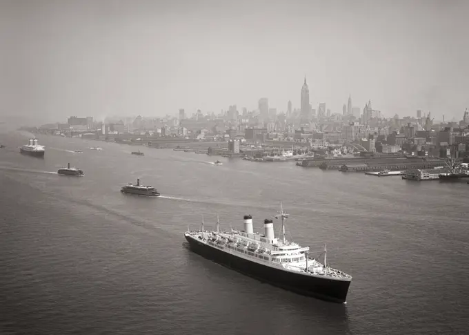 1950s OCEAN LINER SS CONSTITUTION FOLLOWED BY SS UNITED STATES LEAVING MANHATTAN VIA HUDSON RIVER PAST SKYLINE OF NYC USA 