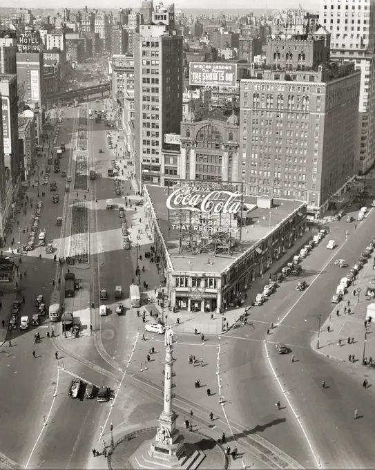 1930s COLUMBUS CIRCLE WITH INTERSECTION OF BROADWAY ON LEFT WITH TROLLEY CARS AND CENTRAL PARK WEST AND 59TH STREETS NYC USA