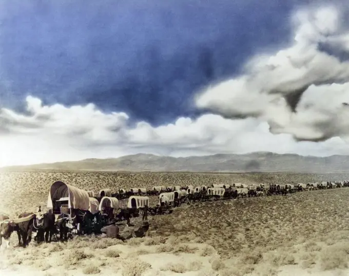 1870s 1880s MONTAGE OF LONG LINES OF COVERED WESTERN LAND SETTLERS AND IMMIGRANT WAGONS CROSSING THE AMERICAN PLAINS