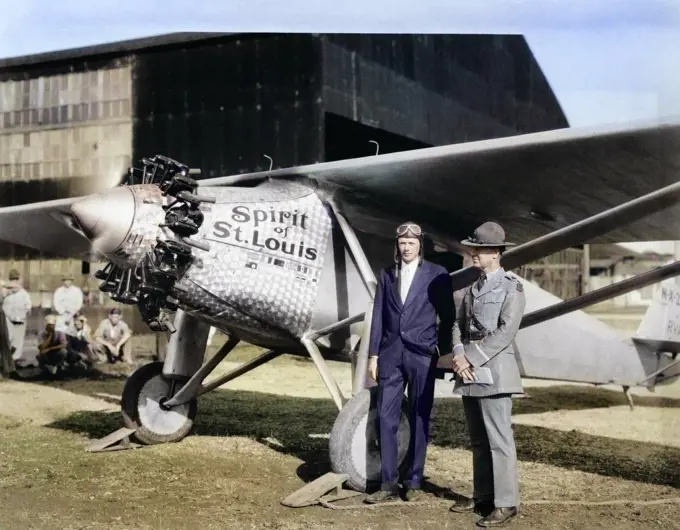 1920s CHARLES LINDBERGH AND LT. COL. FISHER STANDING BY SPIRIT OF ST. LOUIS AIRPLANE ROOSEVELT FIELD MINEOLA LONG ISLAND NY USA