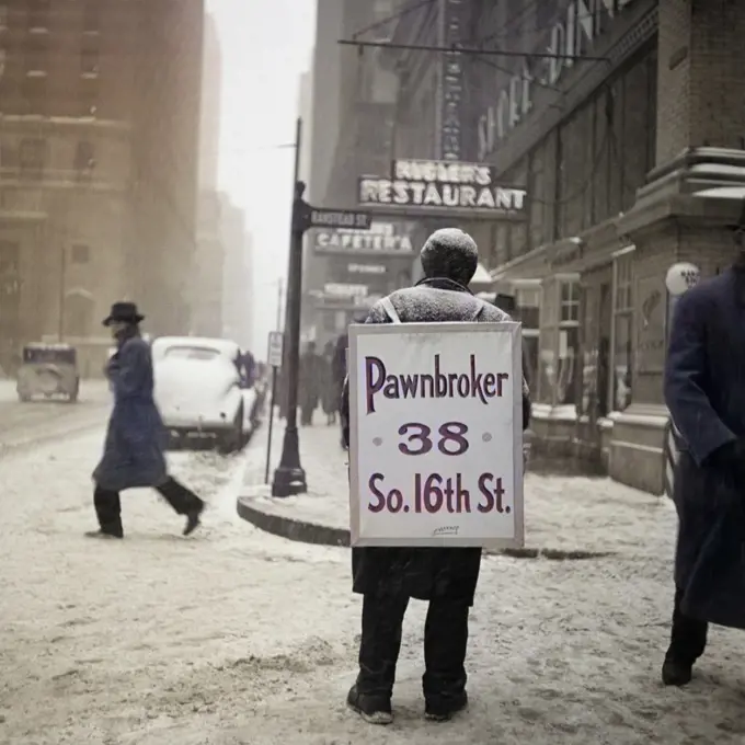 1930s WINTER STREET SCENE OF MAN WEARING PAWNBROKER SANDWICH BOARD