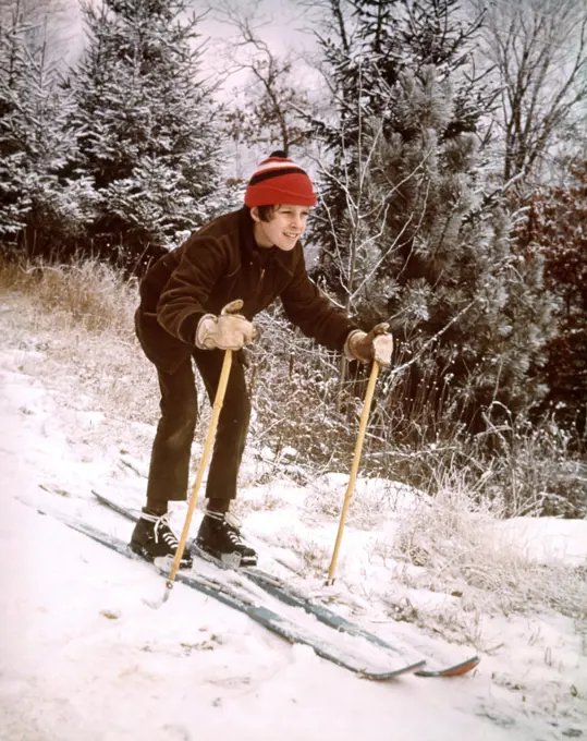 1970s JUVENILE BOY BROWN JACKET RED CAP SKIING SNOW SKIS