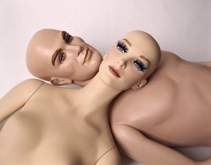1960s MANNEQUIN DUMMY MAN WOMAN LYING HEAD TO HEAD BALD NAKED WOODEN UNEMOTIONAL STIFF 