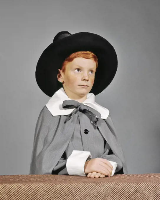 1960s SERIOUS BOY DRESSED IN PILGRIM CLOTHES COSTUME FOR THANKSGIVING SCHOOL PLAY