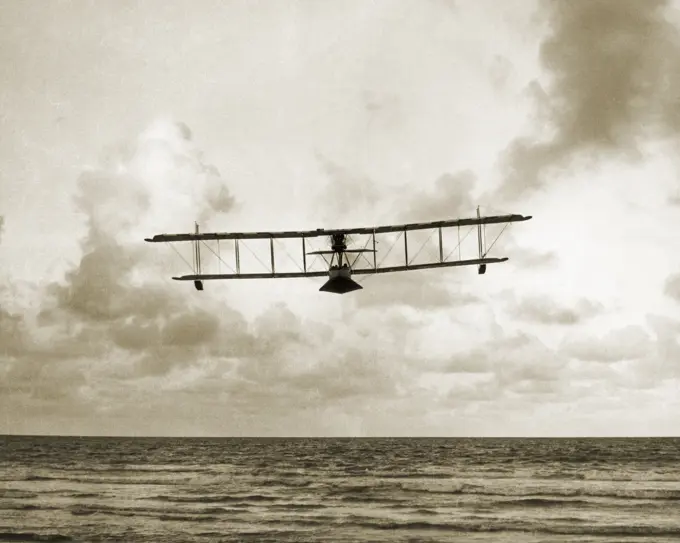 1910s EARLY WALSH BROTHERS WORLD WAR ONE BIPLANE SEAPLANE PILOT TRAINING FLYING BOAT OVER THE OCEAN OUTDOOR NEW ZEALAND