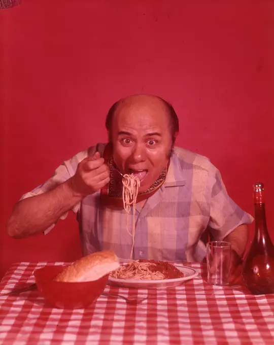 1960S Bald Man Eating Spaghetti