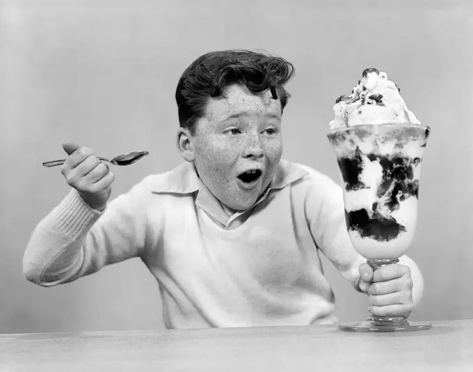 1950S Freckled Boy Digging Into Giant Sundae