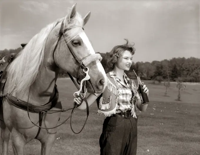 1950S Teenage Girl Western Wear Holding Horse Halter Drinking Carbonated Beverage From Bottle
