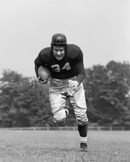 1940S Football Player Running Towards Camera With Football