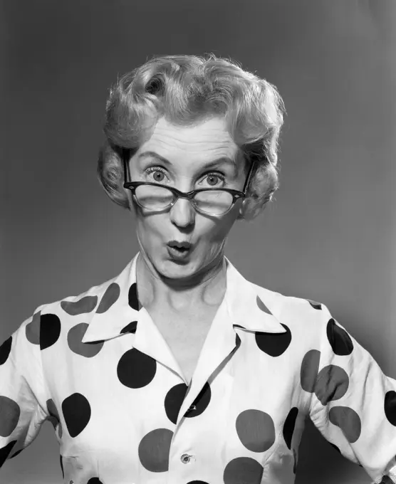 1950S 1960S Portrait Woman Polka Dot Dress Looking Over Eyeglasses