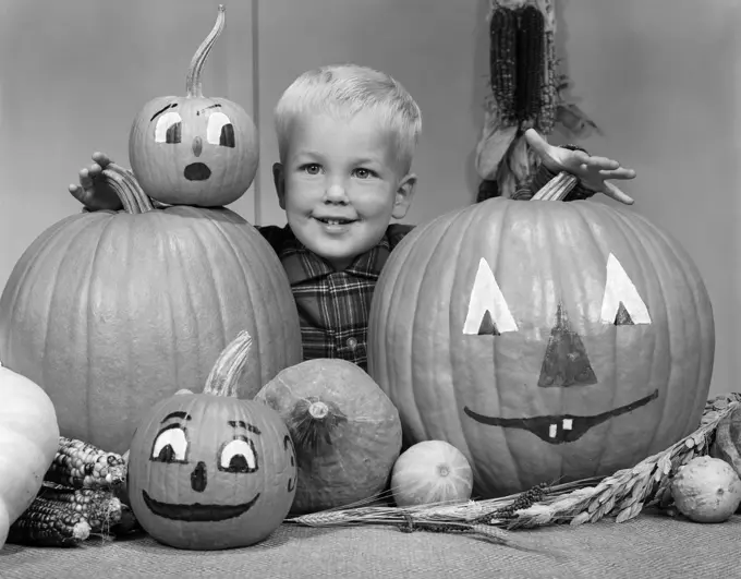 1960S Smiling Blond Boy Surrounded By Pumpkin Patch Jack-O'-Lantern