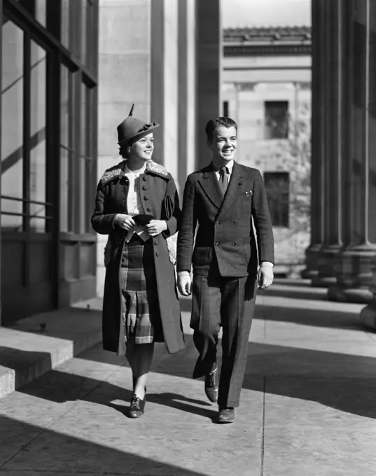 1940S Young Teenage Couple Boy Girl Walking Column Arcade Wearing Business Street Clothes