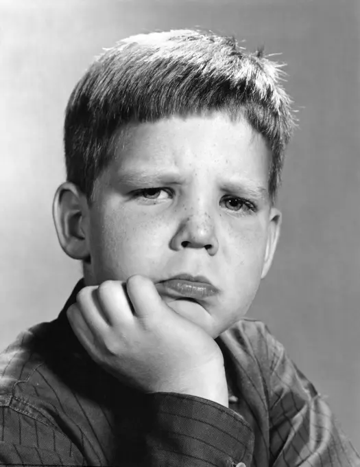 1960S Portrait Pouting Boy Hand To Chin With Angry Sad Serious Facial Expression