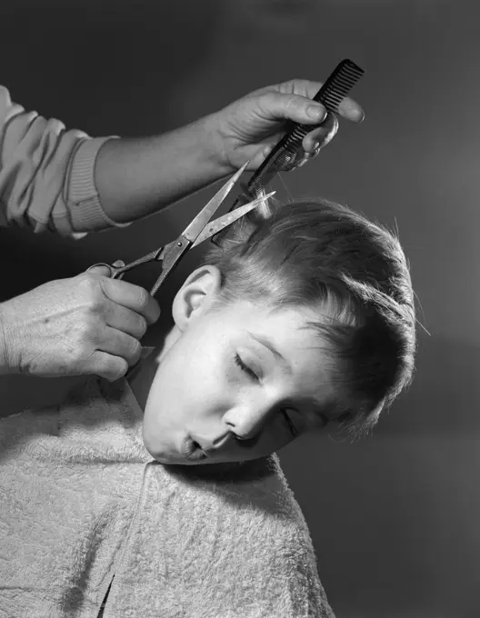 1950S Boy Making Face As Parent Cuts His Hair Barber Comb Scissors Hands Amateur Haircut