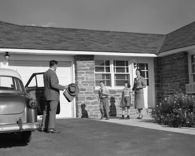 1950S Family Greeting Father In Driveway