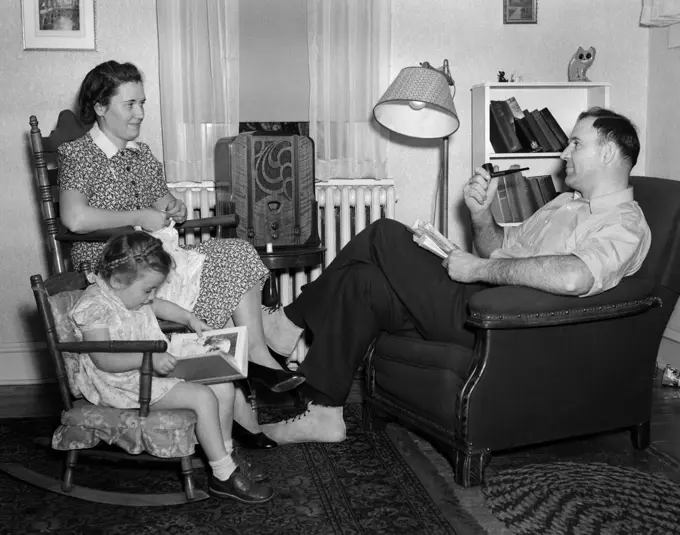 1930S-40S Family Relaxing Near Radio