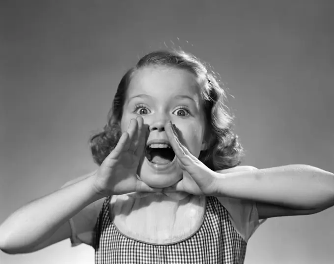 1950S Little Girl Shouting Yelling Hands Cupped Around Wide Open Mouth