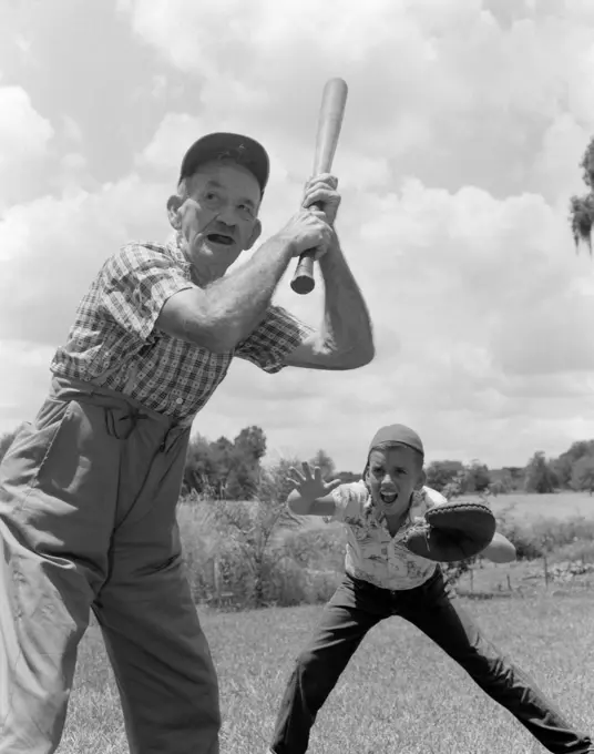 1950S Grandfather At Bat With Boy As Catcher