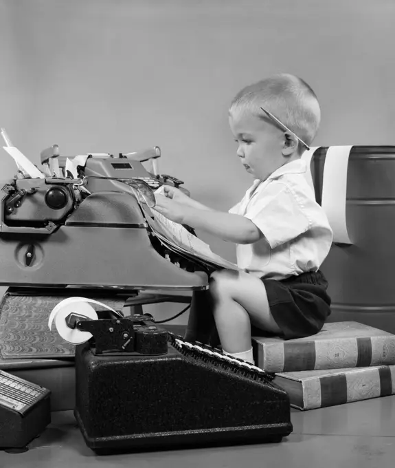 1950S Child Typing Sitting At Typewriter