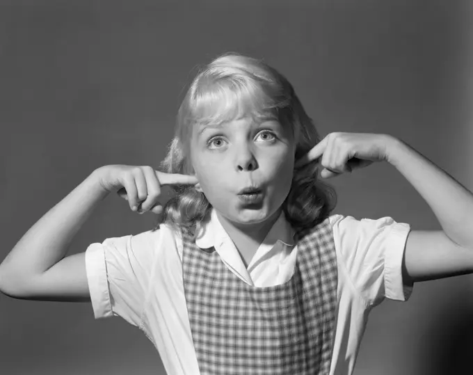 1950S Blond Girl Sticking Fingers In Ears Making Face Quiet Noise