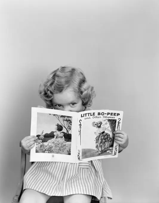 1940S Little Girl Peeking Over Top Of Little Bo-Peep Nursery Rhyme Book