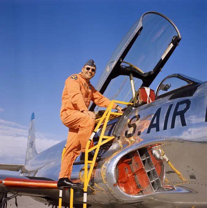 1970S Smiling Military Pilot Ladder Climbing Enter Cockpit Jet Wearing Orange Flight Jump Suit Pilots Men