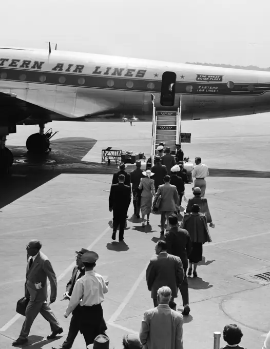 1950S Airplane Boarding Passengers Walking Across Tarmac