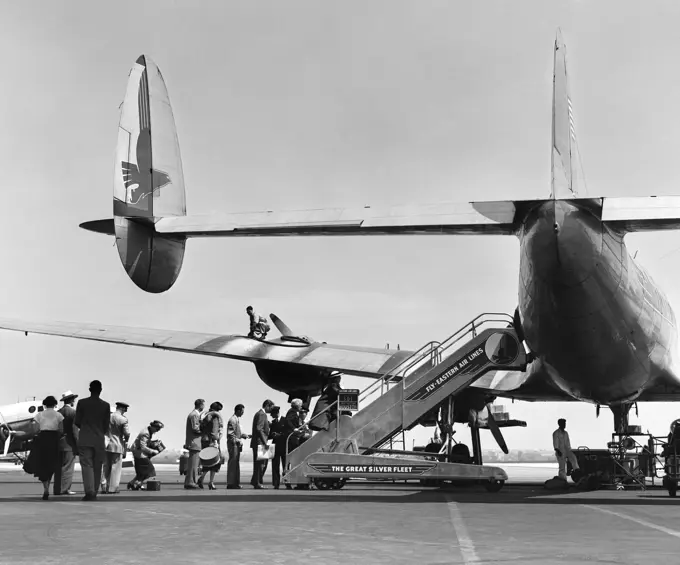 1950S People Boarding Constellation Style Airplane Double Tail Outdoor 