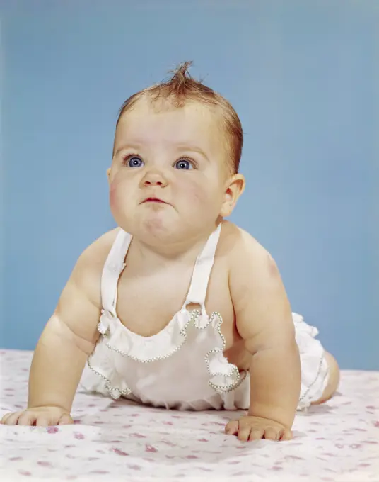 1960S Baby Making Funny Face Pushed Up On Arms Crawling Forward