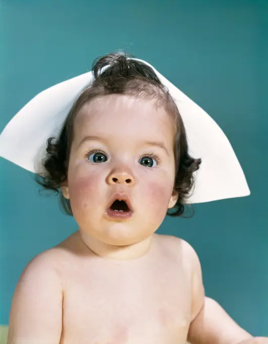 1960S Surprised Baby Facial Expression Wearing A Nurse Cap