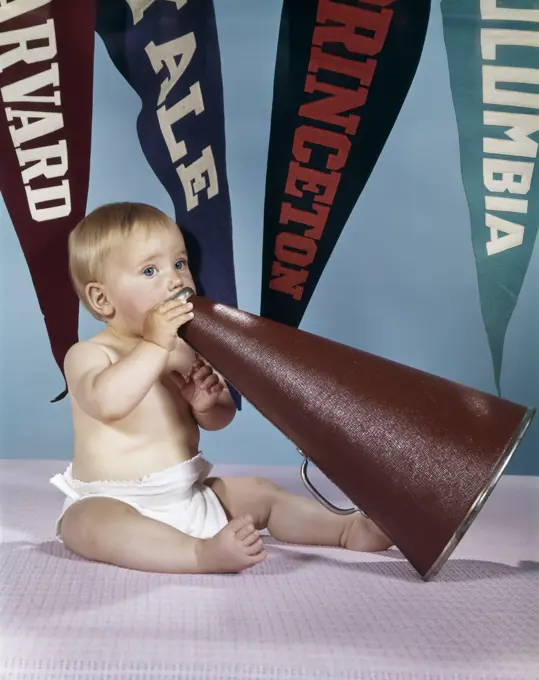 1960S Baby Shouting Into Cheerleader Megaphone College Pennants In Background