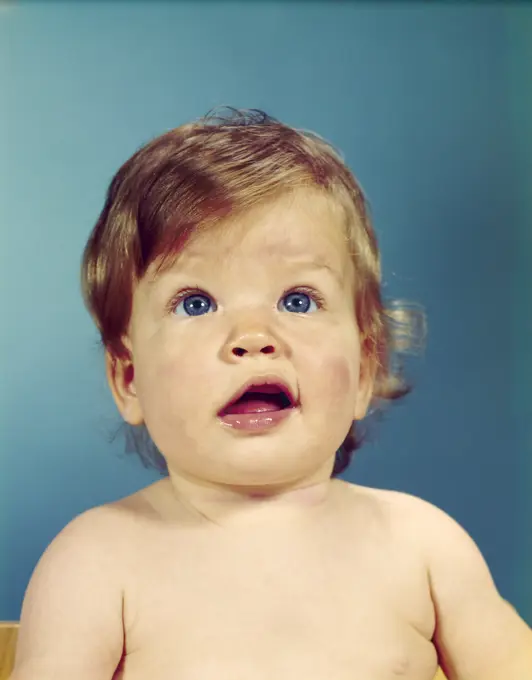 1960S Portrait Baby With Uncertain Inquisitive Facial Expression