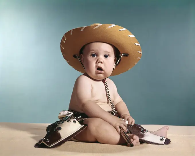 1960S Baby Wearing Cowboy Costume With Funny Facial Expression