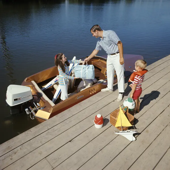 1980S Family On Dock Loading Motor Boat