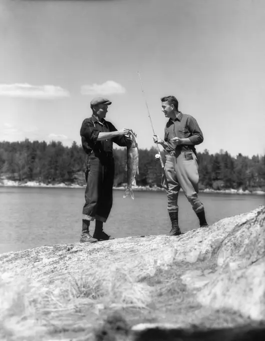 1930S 2 Men Fisherman Holding Up Days Catch Lake Of The Woods Ontario Canada