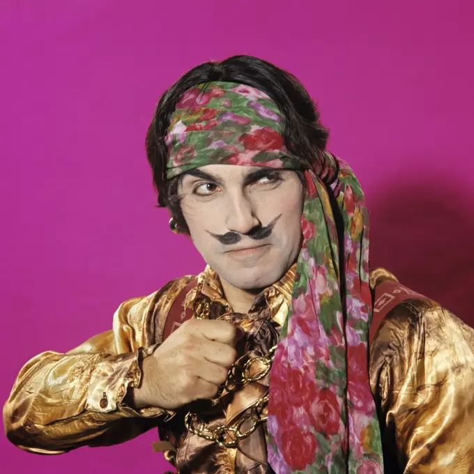 Character Man Funny Expression Gesture Dressed In Pirate Costume Fake Moustache Pink Background Gold Silk Shirt Headband