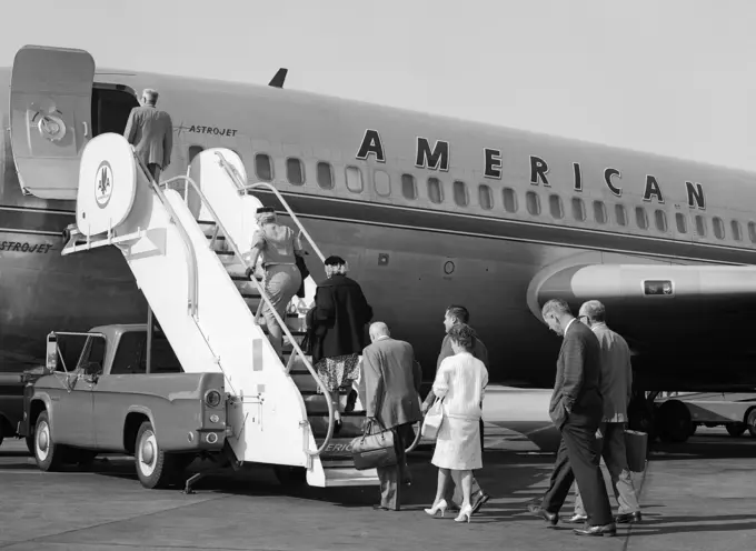 1960S Passengers Boarding American Airlines Astrojet By Way Of Short Stairway Raised From Bed Of Pickup Truck