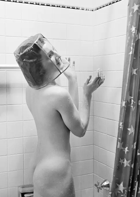 1930s NUDE WOMAN IN SHOWER WEARING SHOWER CAP THAT COVERS HER ENTIRE HEAD