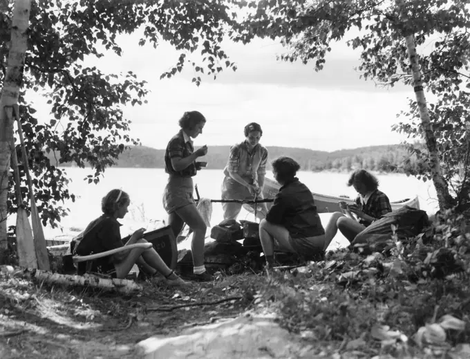 1930s 5 GIRLS AROUND CAMP FIRE NEAR LAKE CANOE SUMMER YOUTH ALGONQUIN PARK CANADA