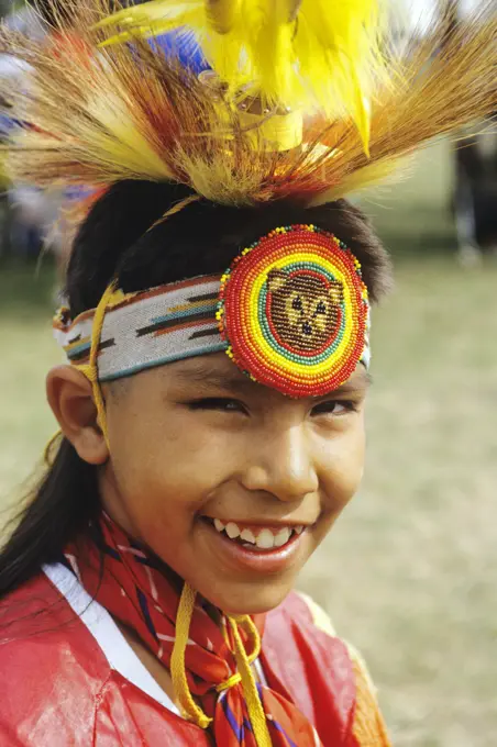 1990s SMILING 12 YEAR OLD CHIPPEWA BOY AT NATIVE AMERICAN INDIAN POW WOW LOOKING AT CAMERA POW WOW MICHIGAN USA